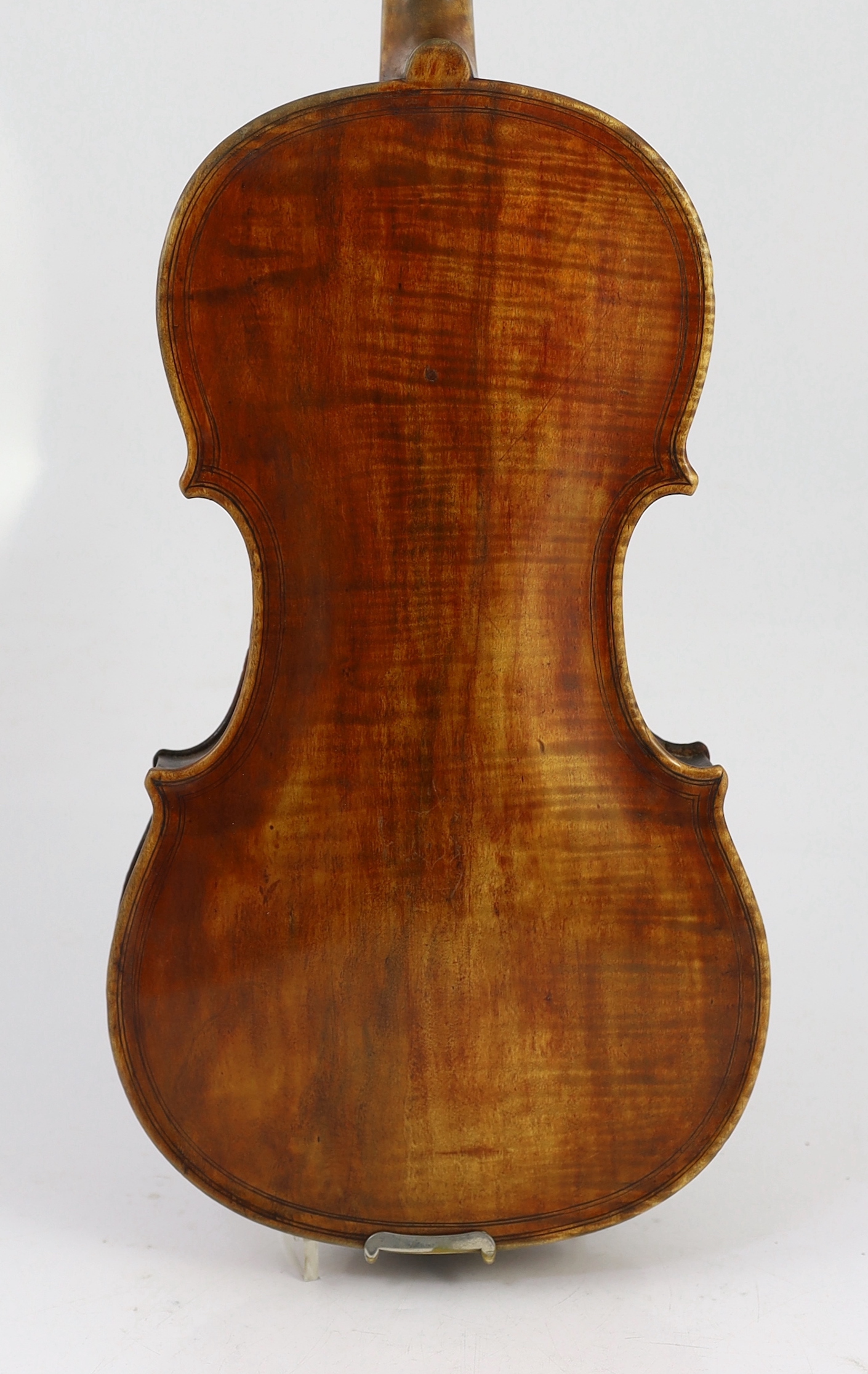 An 18th century violin, labelled ‘New Back by James Carroll, Maker, Manchester 1899’, length of back 36.5cm